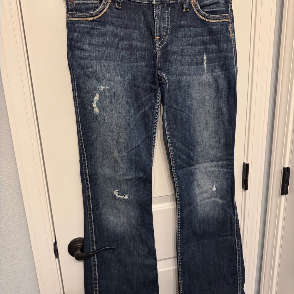Silver Jeans Distressed Boot Cut in Dark Blue 29/33